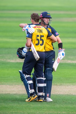 260825 - Glamorgan v Leicestershire - Metro Bank One Day Cup - Asa Tribe of Glamorgan CCC celebrates his century with Will Smale of Glamorgan CCC