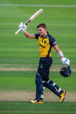 260825 - Glamorgan v Leicestershire - Metro Bank One Day Cup - Asa Tribe of Glamorgan CCC celebrates his century with Will Smale of Glamorgan CCC