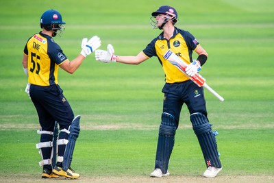 260825 - Glamorgan v Leicestershire - Metro Bank One Day Cup - Will Smale of Glamorgan CCC celebrates his fifty with Asa Tribe of Glamorgan CCC