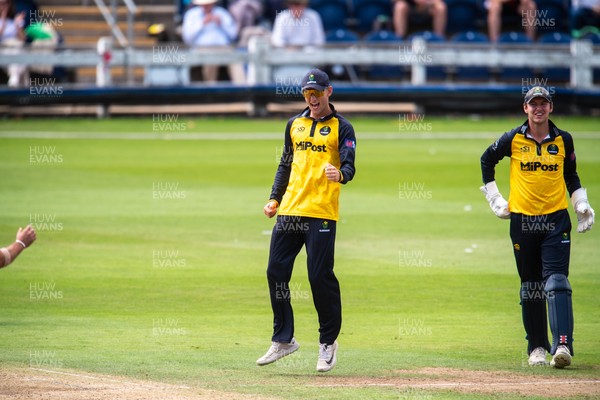 260825 - Glamorgan v Leicestershire - Metro Bank One Day Cup - Henry Hurle of Glamorgan CCC and Will Smale of Glamorgan CCC celebrate the wicket of Peter Hanscombe of Leicestershire CCC
