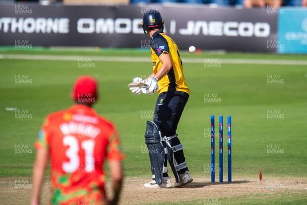 260825 - Glamorgan v Leicestershire - Metro Bank One Day Cup - Henry Hurle of Glamorgan CCC is bowled by Alex Green of Leicestershire CCC