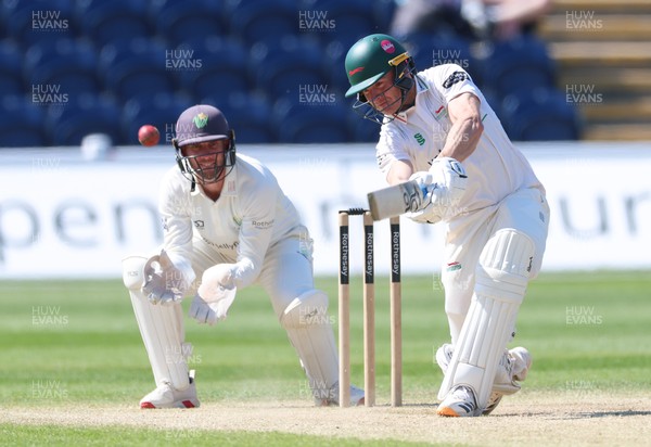 270426 - Glamorgan v Leicestershire, Rothesay County Championship Division 1 - Ben Cox of Leicestershire plays a shot as Chris Cooke of Glamorgan looks on