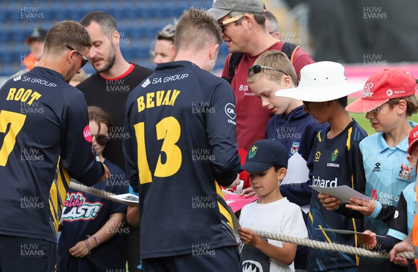 020723 - Glamorgan v Middlesex, Vitality Blast - Tom Bevan of Glamorgan signs autographs for supporters at the end of the match