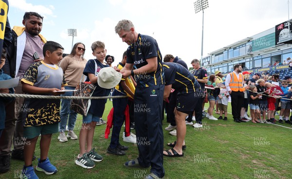 020723 - Glamorgan v Middlesex, Vitality Blast - Timm van der Gugten of Glamorgan  signs autographs for supporters at the end of the match