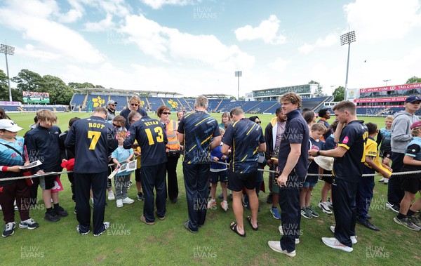 020723 - Glamorgan v Middlesex, Vitality Blast - Glamorgan players sign autographs for supporters at the end of the match