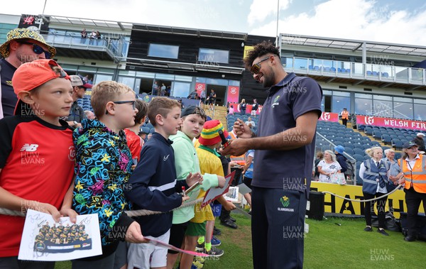 020723 - Glamorgan v Middlesex, Vitality Blast - Prem Sisodiya of Glamorgan signs autographs for supporters at the end of the match
