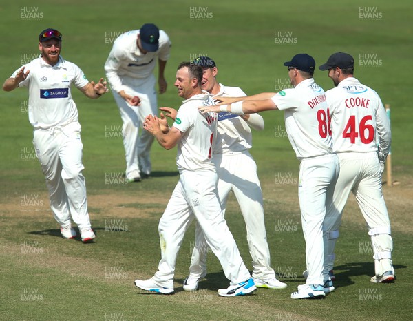 140719 - Glamorgan v Middlesex, Specsavers County Championship Division 2 - Graham Wagg of Glamorgan celebrates as he runs out Dawid Malan of Middlesex