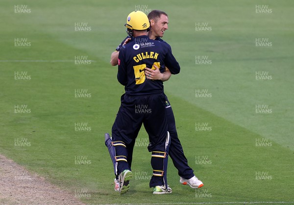 180621 - Glamorgan v Middlesex - T20 Blast - David Lloyd of Glamorgan celebrates with Tom Cullen after bowling out John Simpson for LBW