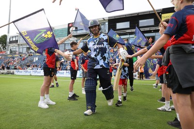 180725 - Glamorgan v Middlesex - Vitality T20 Blast - Kiran Carlson of Glamorgan walks onto the field