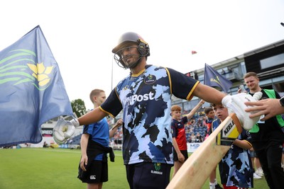 180725 - Glamorgan v Middlesex - Vitality T20 Blast - Kiran Carlson of Glamorgan walks onto the field