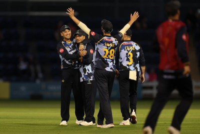 180725 - Glamorgan v Middlesex - Vitality T20 Blast - Kiran Carlson of Glamorgan celebrates with Colin Ingram after dismissing Noah Cornwell
