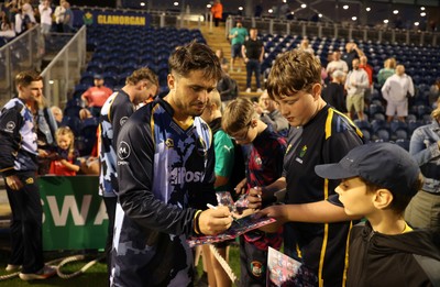 180725 - Glamorgan v Middlesex - Vitality T20 Blast - Kiran Carlson of Glamorgan signs autographs