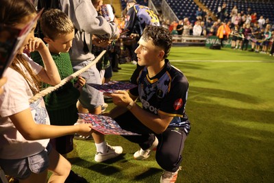 180725 - Glamorgan v Middlesex - Vitality T20 Blast - Ned Leonard of Glamorgan signs autographs
