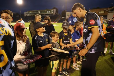 180725 - Glamorgan v Middlesex - Vitality T20 Blast - Ned Leonard of Glamorgan signs autographs