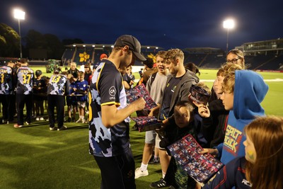 180725 - Glamorgan v Middlesex - Vitality T20 Blast - Will Smale of Glamorgan signs autographs
