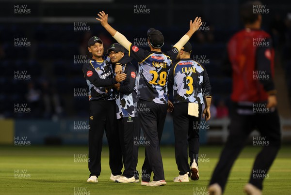 180725 - Glamorgan v Middlesex - Vitality T20 Blast - Kiran Carlson of Glamorgan celebrates with Colin Ingram after dismissing Noah Cornwell