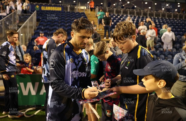 180725 - Glamorgan v Middlesex - Vitality T20 Blast - Kiran Carlson of Glamorgan signs autographs