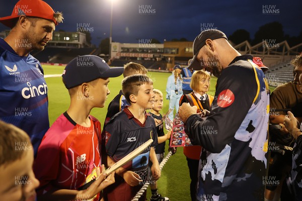 180725 - Glamorgan v Middlesex - Vitality T20 Blast - Jamie McIlroy of Glamorgan signs autographs