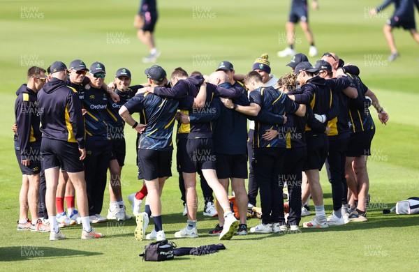 210422 - Glamorgan v Middlesex, LV= County Championship Division 2  - The Glamorgan squad huddle together during warm up