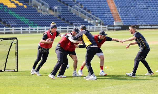 210422 - Glamorgan v Middlesex, LV= County Championship Division 2  - The Glamorgan squad warm up ahead of the start of the match