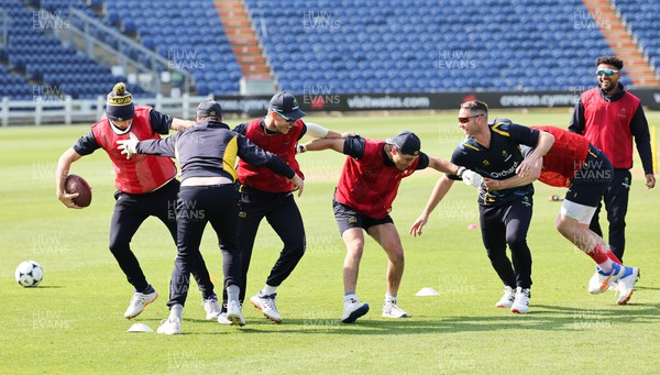 210422 - Glamorgan v Middlesex, LV= County Championship Division 2  - The Glamorgan squad warm up ahead of the start of the match