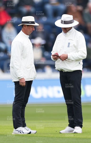 220422 - Glamorgan v Middlesex, LV= County Championship Division 2  - The umpires inspect the ball during a break in play
