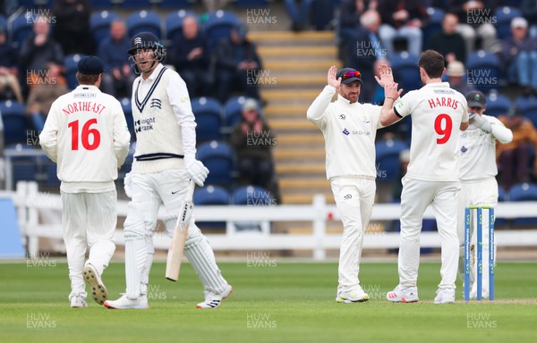 220422 - Glamorgan v Middlesex, LV= County Championship Division 2  - James Harris of Glamorgan  celebrates with David Lloyd of Glamorgan after Glamorgan take the wicket of Toby Roland-Jones of Middlesex