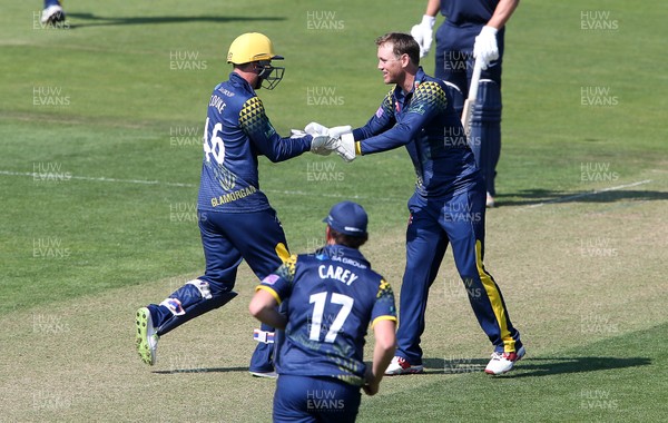 230518 - Glamorgan v Middlesex - Royal London One Day Cup - Colin Ingram and Chris Cooke of Glamorgan celebrates after Cooke catches John Simpson of Middlesex