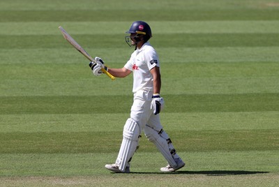 230525 - Glamorgan v Middlesex - Rothesay County Championship, Division Two - Kiran Carlson of Glamorgan acknowledges his half century