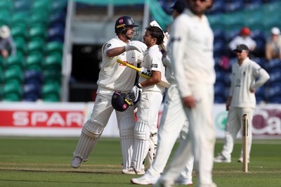 230525 - Glamorgan v Middlesex - Rothesay County Championship, Division Two - Kiran Carlson of Glamorgan celebrates scoring a century with Sam Northeast