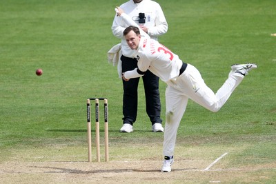 250525 - Glamorgan v Middlesex - Rothesay County Championship - Matthew Kuhnemann of Glamorgan bowls out Max Holden of Middlesex