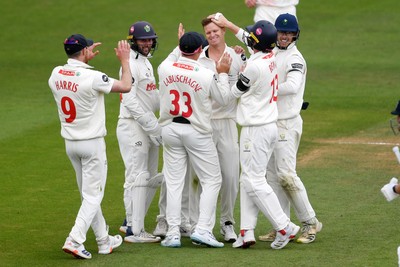 250525 - Glamorgan v Middlesex - Rothesay County Championship - Matthew Kuhnemann of Glamorgan celebrates taking the wicket of Leus du Plooy