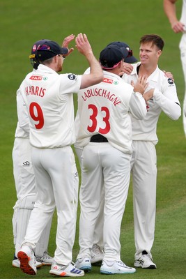 250525 - Glamorgan v Middlesex - Rothesay County Championship - Matthew Kuhnemann of Glamorgan celebrates taking the wicket of Leus du Plooy