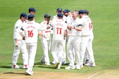 250525 - Glamorgan v Middlesex - Rothesay County Championship - Kiran Carlson of Glamorgan catches the ball to dismiss Luke Hollman of Middlesex