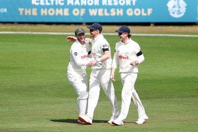 250525 - Glamorgan v Middlesex - Rothesay County Championship - James Harris of Glamorgan celebrates with team mates catching the ball to dismiss Toby Roland-Jones of Middlesex