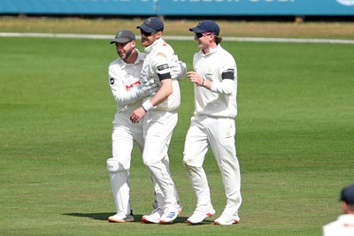 250525 - Glamorgan v Middlesex - Rothesay County Championship - James Harris of Glamorgan celebrates with team mates catching the ball to dismiss Toby Roland-Jones of Middlesex
