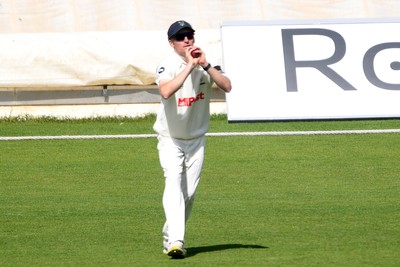250525 - Glamorgan v Middlesex - Rothesay County Championship - Andy Gorvin of Glamorgan catches the ball to dismiss Dane Paterson of Middlesex and are all out