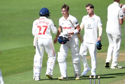 250525 - Glamorgan v Middlesex - Rothesay County Championship - Zain Ul-Hassan and Asa Tribe of Glamorgan at the end of the match