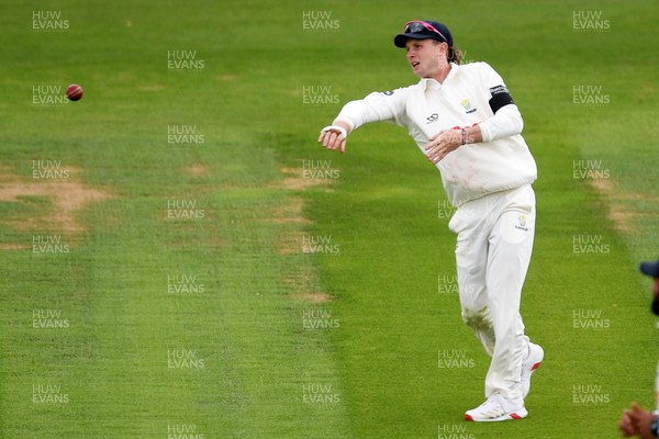250525 - Glamorgan v Middlesex - Rothesay County Championship - Tom Bevan of Glamorgan throws the ball