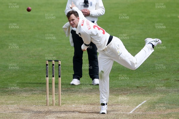 250525 - Glamorgan v Middlesex - Rothesay County Championship - Matthew Kuhnemann of Glamorgan bowls out Max Holden of Middlesex