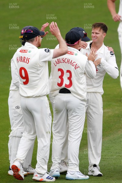 250525 - Glamorgan v Middlesex - Rothesay County Championship - Matthew Kuhnemann of Glamorgan celebrates taking the wicket of Leus du Plooy