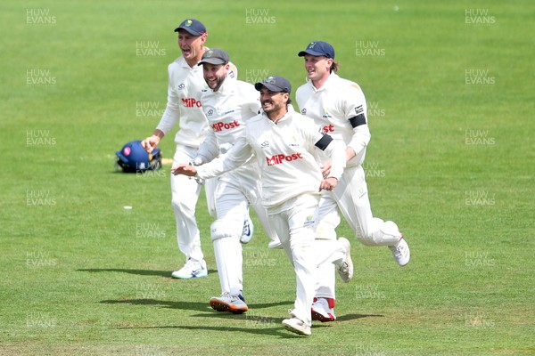 250525 - Glamorgan v Middlesex - Rothesay County Championship - Kiran Carlson of Glamorgan catches the ball to dismiss Luke Hollman of Middlesex