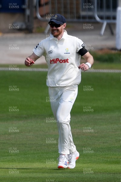 250525 - Glamorgan v Middlesex - Rothesay County Championship - James Harris of Glamorgan celebrates after catching the ball to dismiss Jack Davies of Middlesex