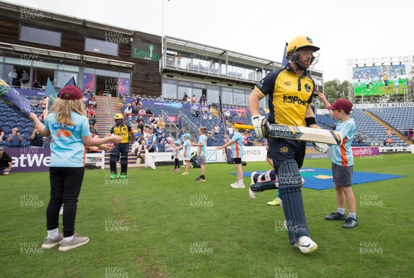 260719 - Glamorgan v Middlesex, Vitality Blast - David Lloyd of Glamorgan and Fakhar Zaman of Glamorgan make their way to the wicket at the start of the match