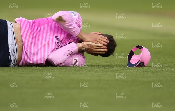 260719 - Glamorgan v Middlesex, Vitality Blast - Stephen Eskinazi of Middlesex reacts after being struck in the face by the ball