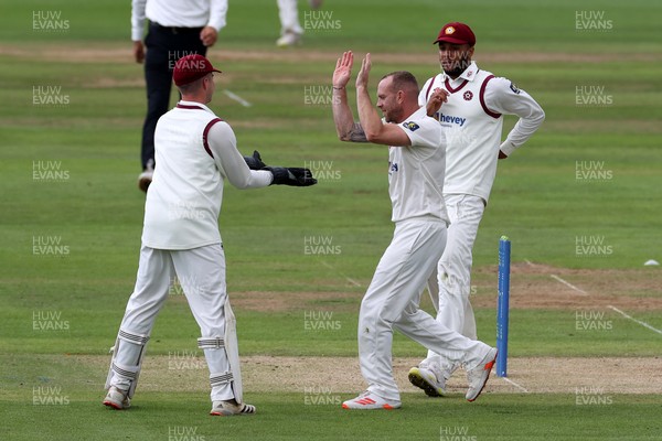 120721 - Glamorgan v Northamptonshire - LV= County Championship - Luke Procter celebrates with Harry Gouldstone after Joe Cooke is caught by Ricardo Vasconcelos