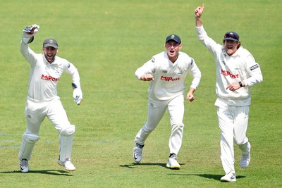 180525 - Glamorgan v Northamptonshire - Rothesay County Championship - Chris Cooke of Glamorgan celebrates with Marnus Labuschange and Sam Northeast after he catches the ball to dismiss Luke Procter of Northamptonshire