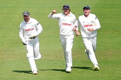 180525 - Glamorgan v Northamptonshire - Rothesay County Championship - Chris Cooke of Glamorgan celebrates with Marnus Labuschange and Sam Northeast after he catches the ball to dismiss Luke Procter of Northamptonshire