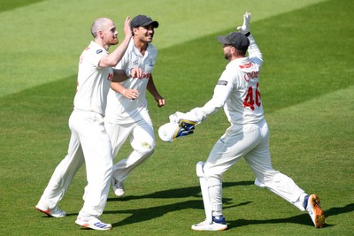 180525 - Glamorgan v Northamptonshire - Rothesay County Championship - James Harris of Glamorgan celebrates with team mates after he bowls the ball to dismiss Saif Zaib of Northamptonshire