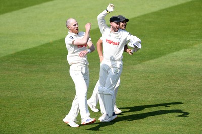 180525 - Glamorgan v Northamptonshire - Rothesay County Championship - James Harris of Glamorgan celebrates with team mates after he bowls the ball to dismiss Saif Zaib of Northamptonshire